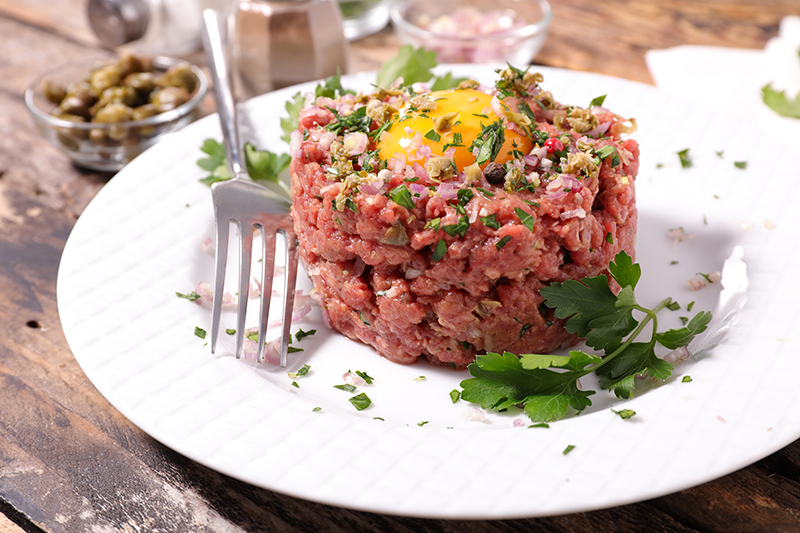 Homemade steak tartare with fresh herbs